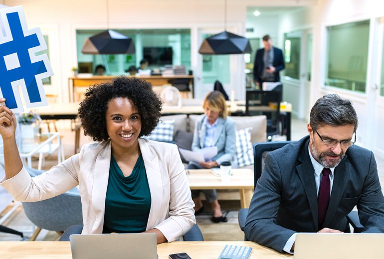 Woman with hashtag at office