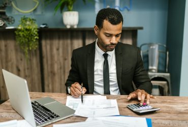 man using calculator